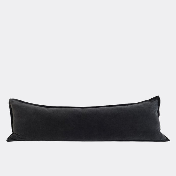 A full image of a velvet long lumbar cushion, in a sophisticated deep midnight shade by Eadie Lifestyle