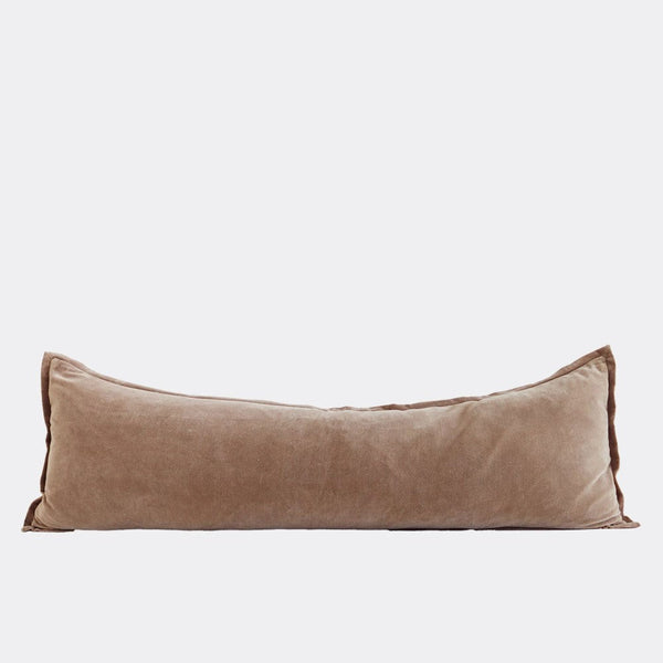 A full image of a velvet long lumbar cushion, in a rich warm brown-caramel by Eadie Lifestyle