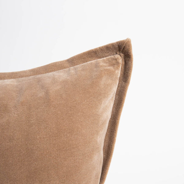 A corner image of a velvet long lumbar cushion, in a rich natural brown-beige by Eadie Lifestyle