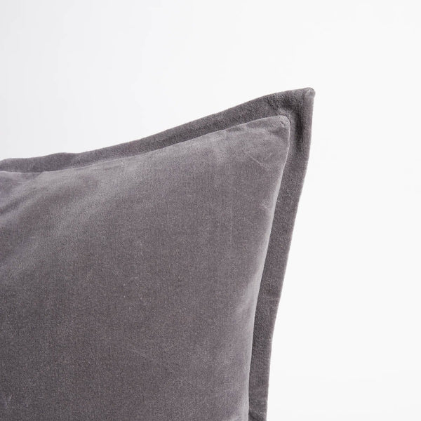 A corner image of a velvet long lumbar cushion, in a sophisticated slate grey by Eadie Lifestyle