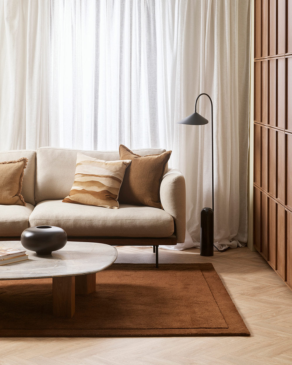 A stylish cream and brown toned living room with a luxuriously deep pile chocolate coloured cut pile floor rug in 100% NZ wool.