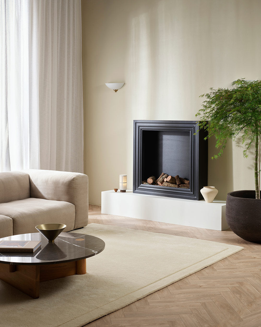 A minimalist living room with a luxurious deep cut pile floor rug in a creamy ivory tones, in 100% NZ wool.