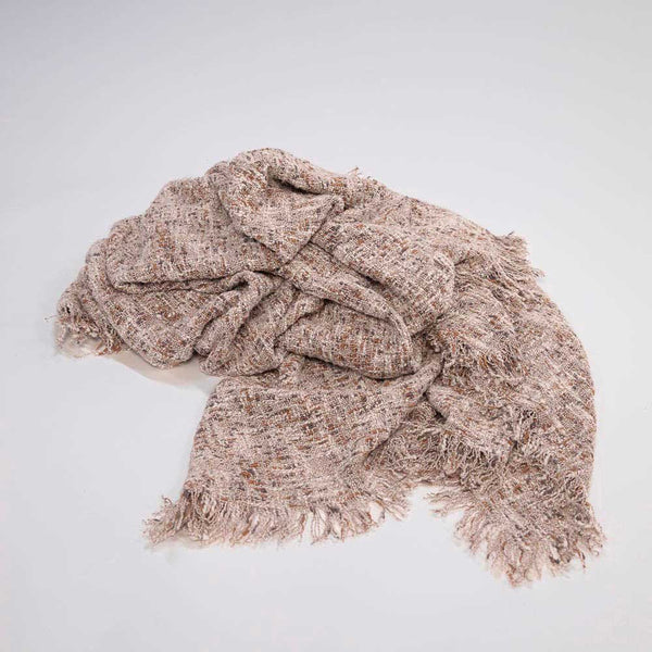 A highly textured, slub-weave 100% cotton throw blanket in warm clay tones.