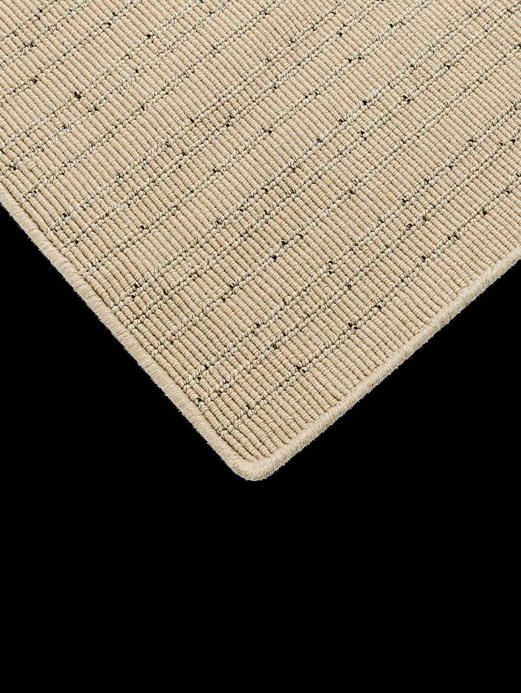 The corner of the Tribe Home Fritz floor rug in colour Sand/Pink