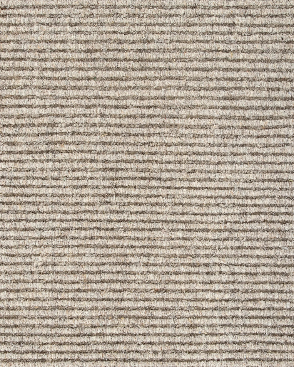 Close up of the Baya 'Vermont' wool floor rug in colour 'Driftwood' showing textural weave