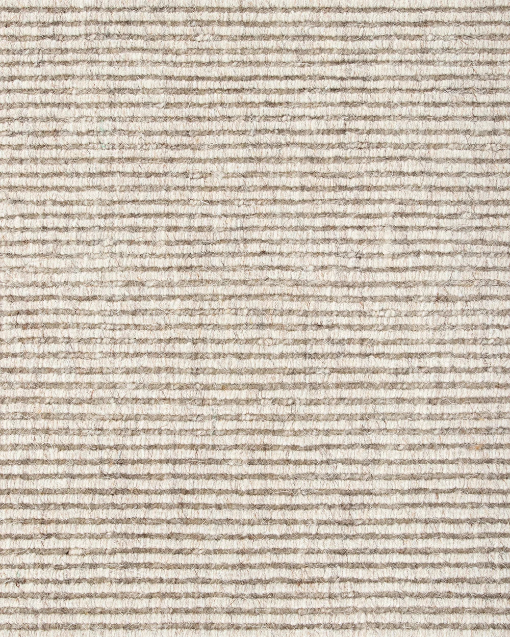 Close up of the Baya wool rug 'Vermont' in colour 'Sand showing the textural weave