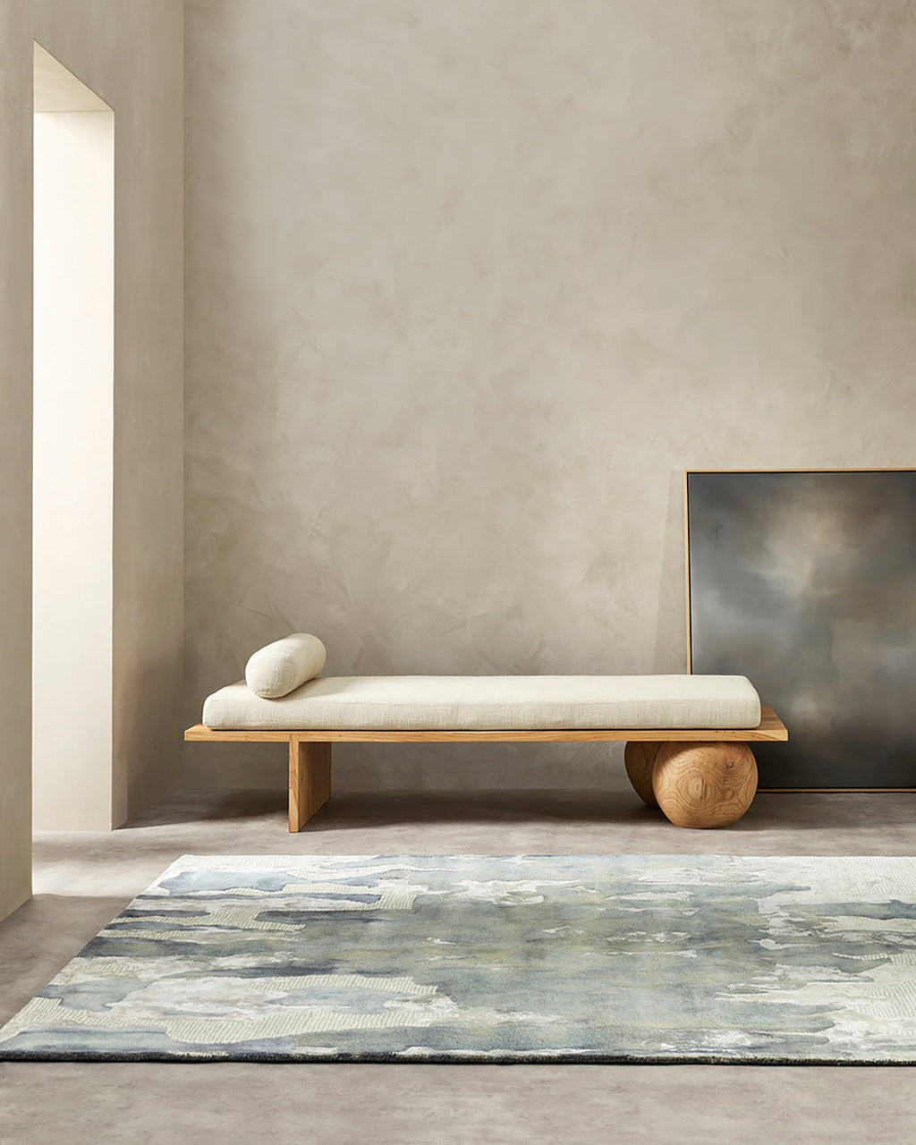 Cool toned design rug situated in a modern style living room.