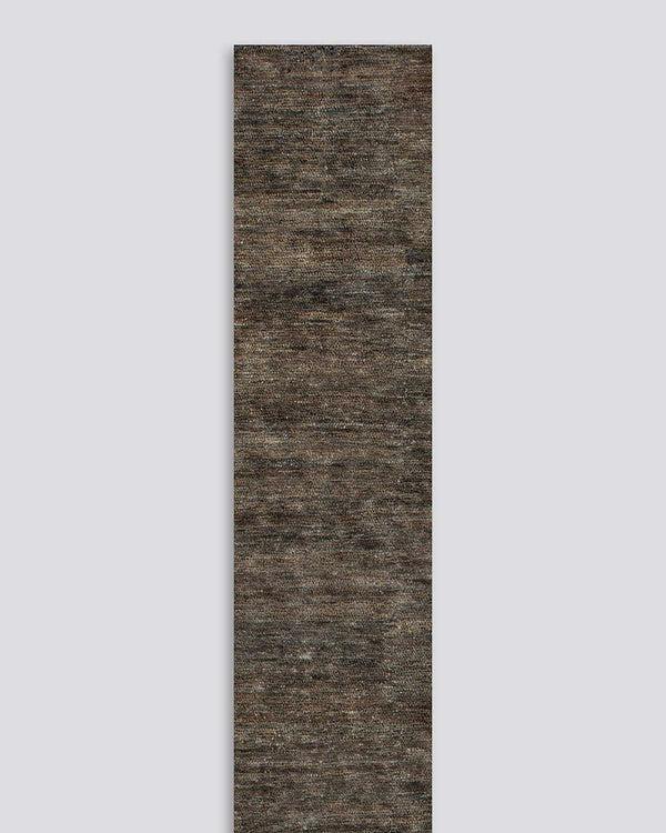 A full image of the Fairbanks floor rug, a bamboo silk and jute blend. The warm brown of the jute blends with the soft greys of the silk in a beautiful medley.