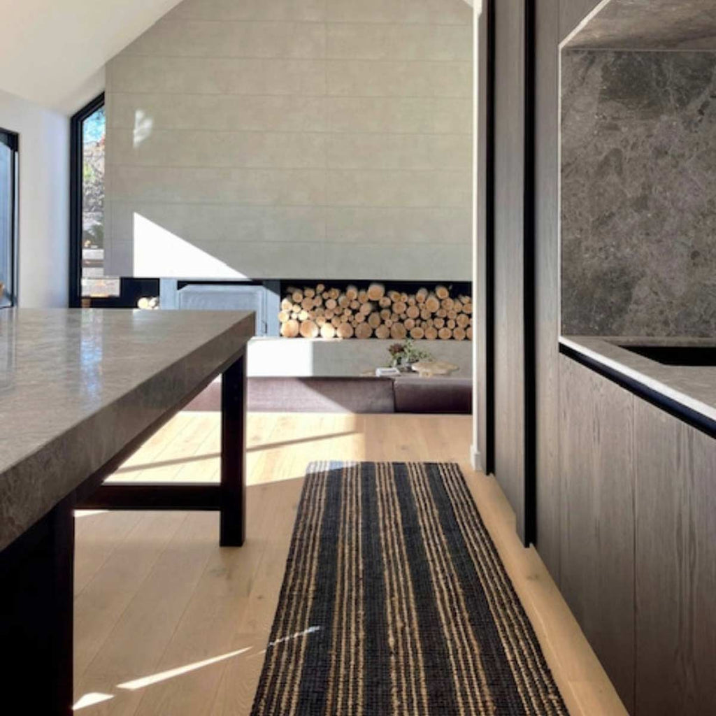 A long hallway runner with black and brown striping, made with 100% natural jute fibres.