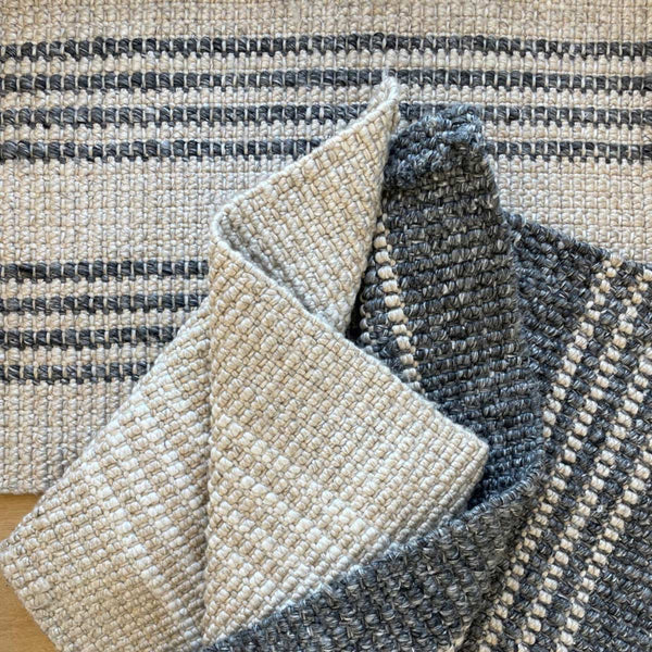 Three entrance mats, all made from 100% recycled PET, with stripes in varying shades, from Zebra Home.