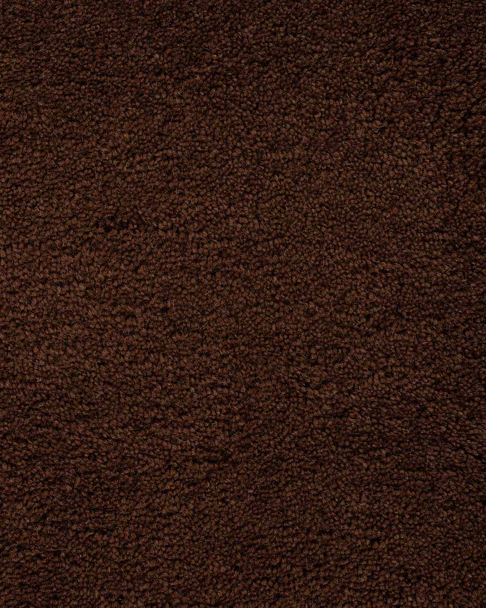 A close up of the weave of the Norfolk floor rug in Chocolate. The luxurious depth of the pile and sumptuous warm, deep brown colour make this rug a standout.