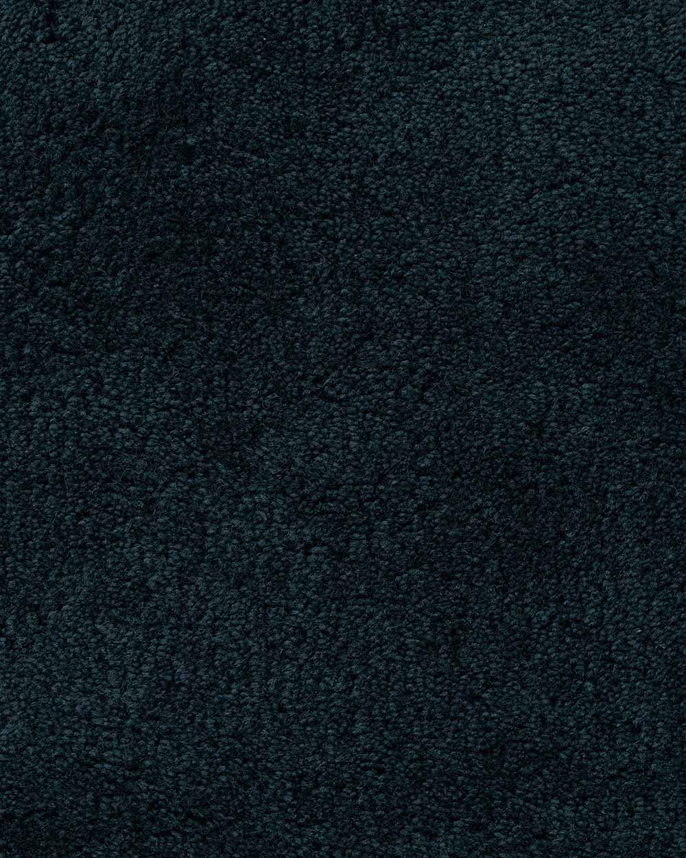 A close up of the weave, 100% wool, a deep navy blue luxuriously deep pile.