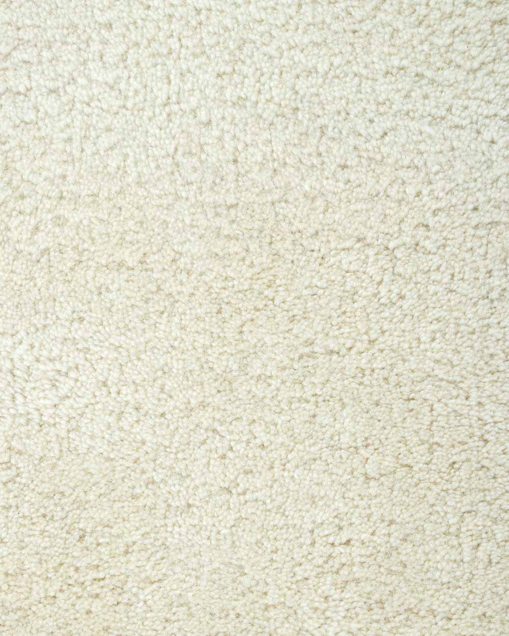 A close up of the weave of the Norfolk floor rug in Ivory. The luxurious depth of the pile and sumptuous warm cream colour make this rug a standout.