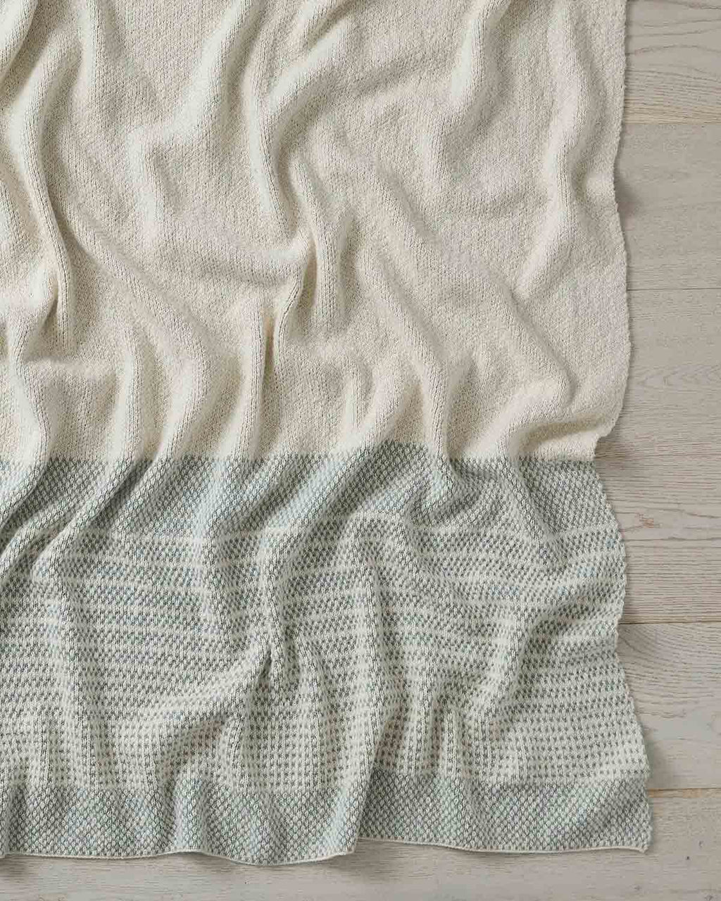 A full image of the Sonoma throw blanket in shade Laurel, by Weave Home.