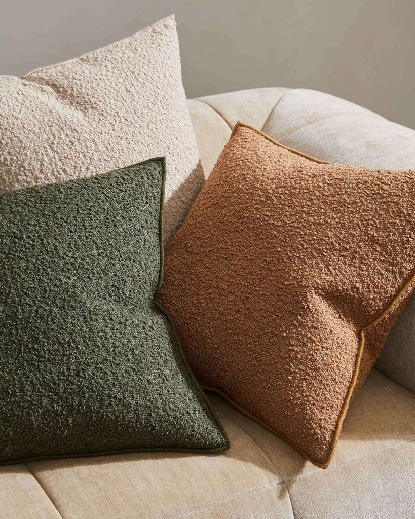 Alberto Boucle cushions i copper, olive and ivory colourways