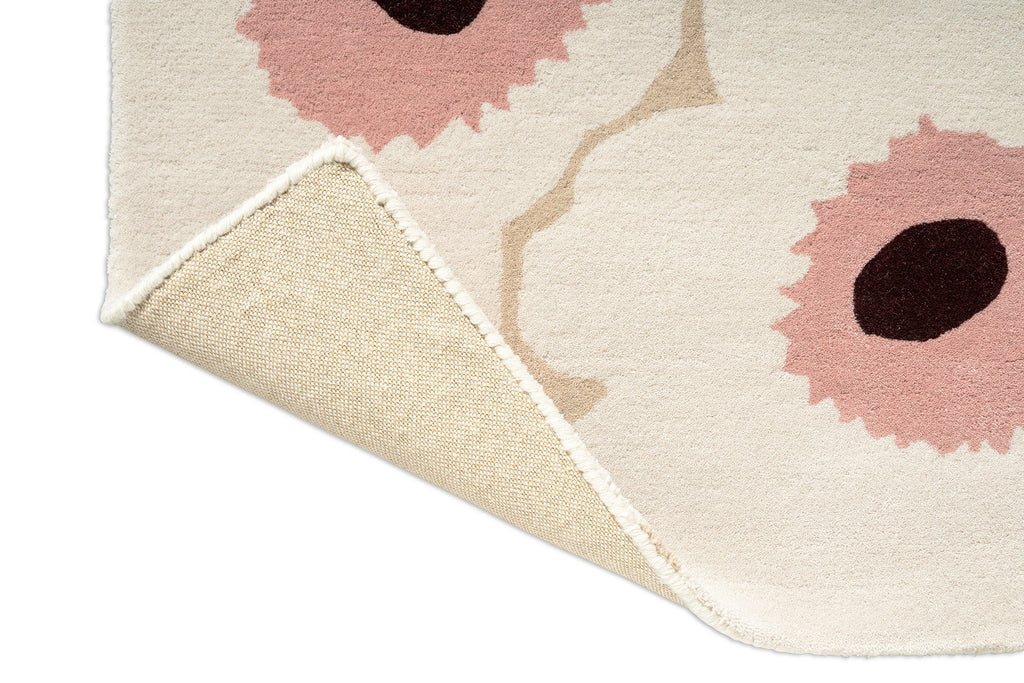 Marimekko hallway runner rug in NZ wool with white, pink and beige, corner folded to show backing