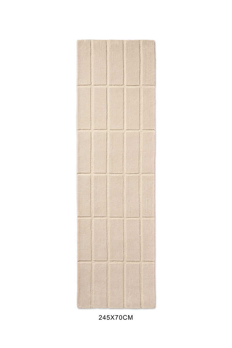 A Marimekko grid patterned runner rug in a neutral creamy white, seen from above