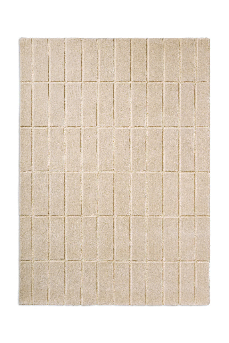 A Marimekko grid patterned rug in NZ wool and in a neutral creamy white