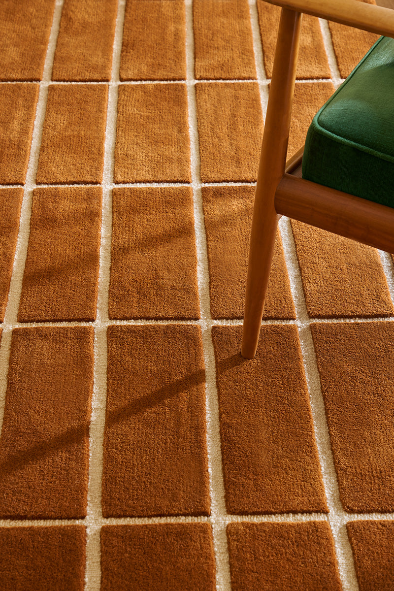 Marimekko NZ wool rust patterned rug seen close up under chair rugs