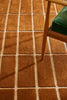 Marimekko NZ wool rust patterned rug seen close up under chair rugs