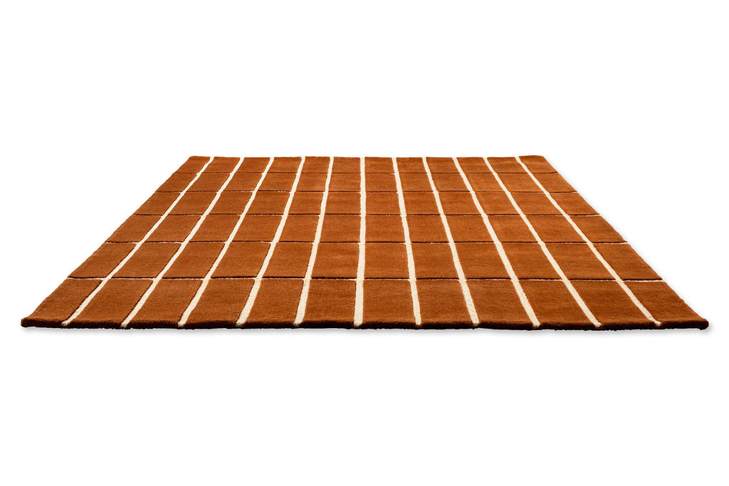 Perspecitive view of a Marimekko NZ wool rust patterned rug