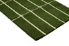 Corner view of a green geometric Marimekko NZ wool runner rug 
