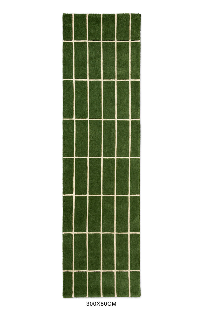 Top view of a green geometric Marimekko NZ wool rug 