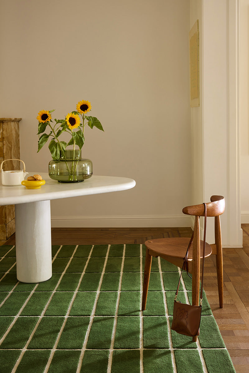 Dining room featuring a green geometric Marimekko NZ wool rug 