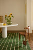 Dining room featuring a green geometric Marimekko NZ wool rug 