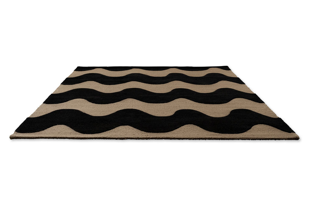 A full Marimekko NZ wool Rug with black wavy pattern on beige background shpwm in perspective