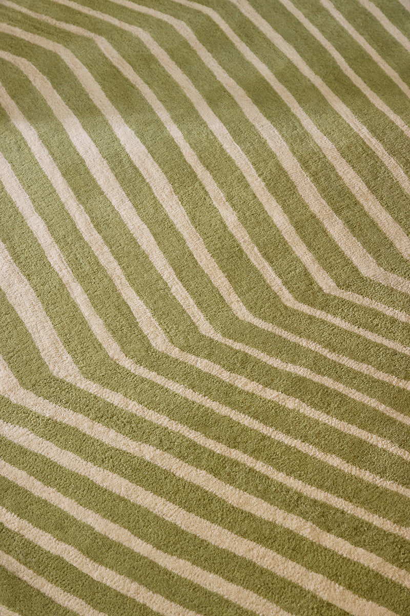 Close-up of a Marimekko green and beige geometric NZ wool rug