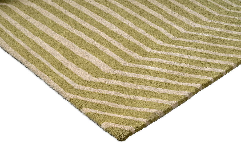 Corner close-up of a Marimekko green and beige geometric NZ wool rug