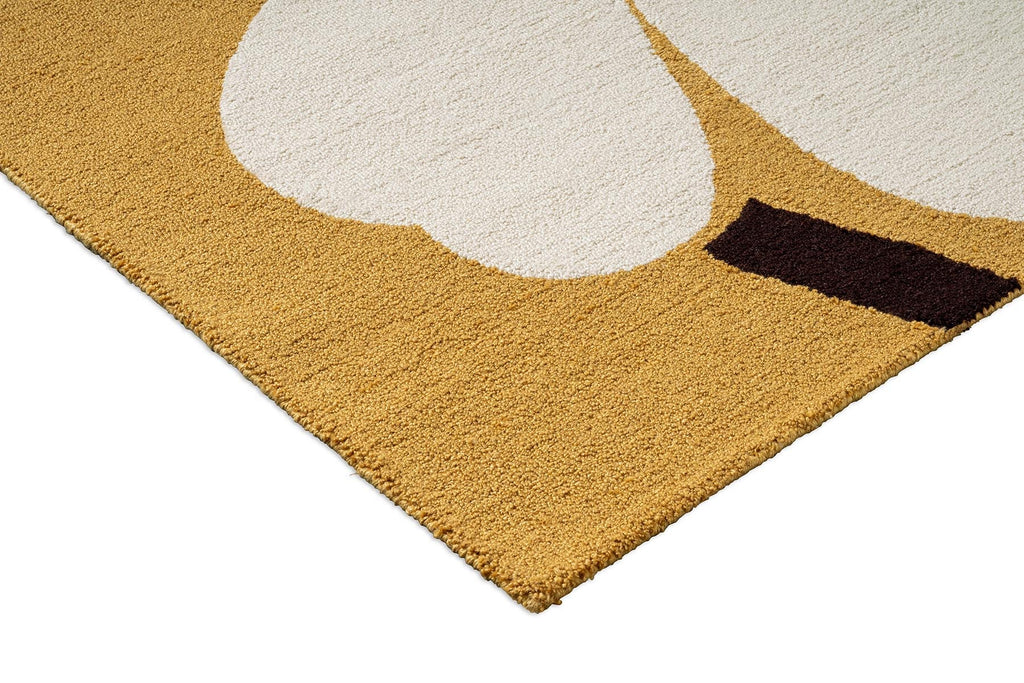 Close up of the Marimekko outdoor rug featuring the iconic Unikko floral design in white, orange and mustard