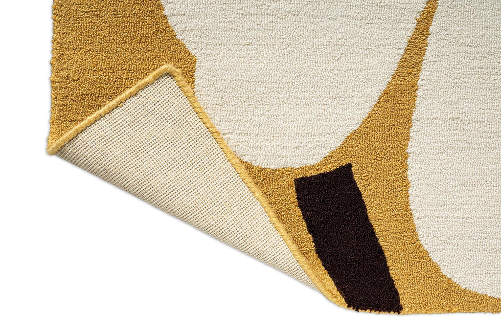 Corner of a Marimekko outdoor rug featuring the iconic Unikko floral design in white, orange and mustard