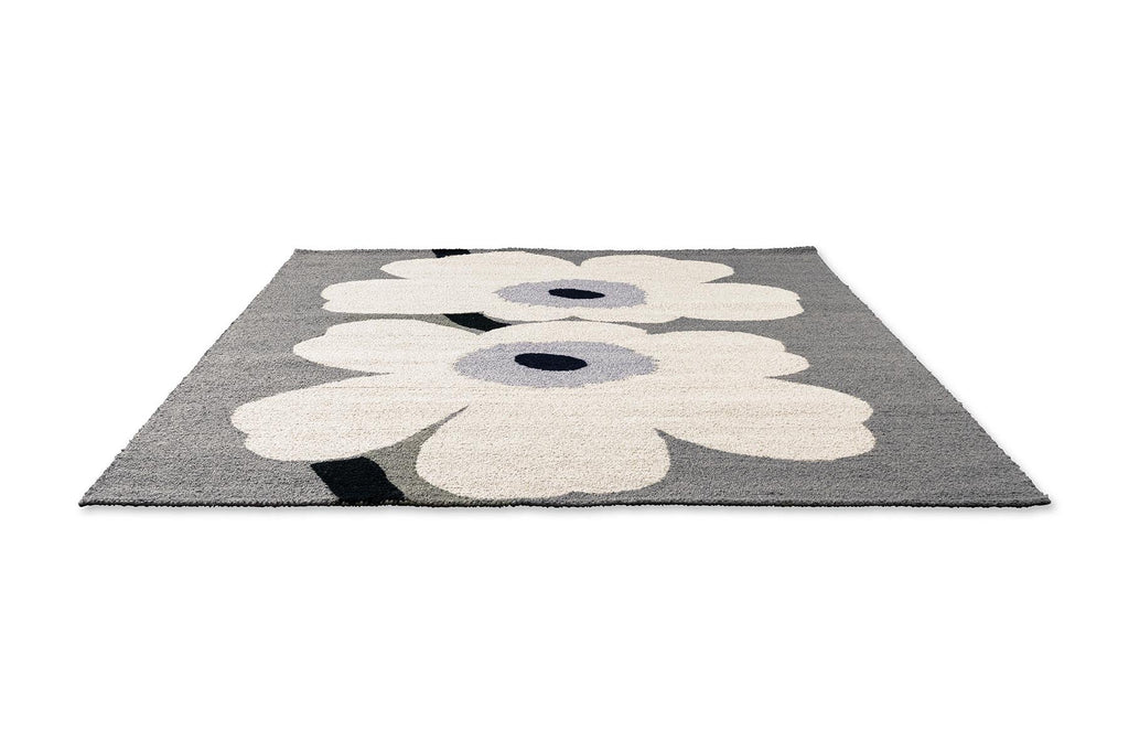 Marimekko floral-patterned outdoor rug with white flowers on a grey background