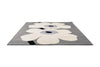 Marimekko floral-patterned outdoor rug with white flowers on a grey background