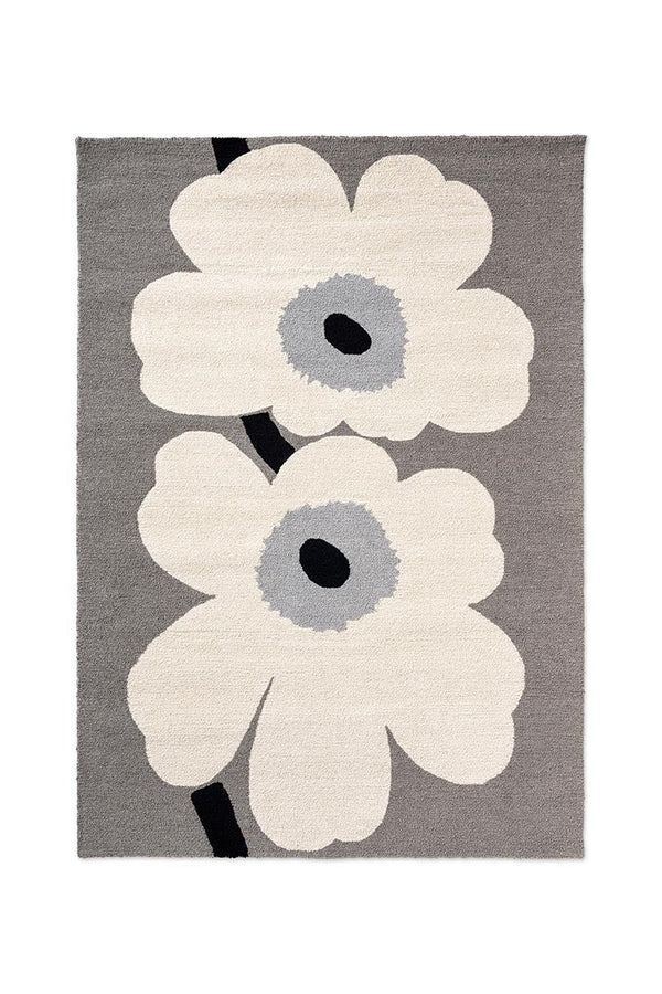Marimekko Unikko white floral outdoor rug with a grey background