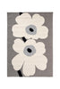Marimekko Unikko white floral outdoor rug with a grey background