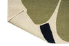 Close-up of a Marimekko outdoor rug with green leaf design on a beige background