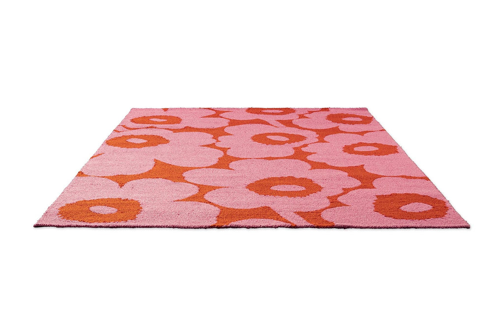 Marimekko Unikko outdoor floral patterned rug with pink and orange flowers.