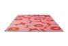 Marimekko Unikko outdoor floral patterned rug with pink and orange flowers.