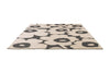 Marimekko floral patterned outdoor rug with black flowers on a beige background