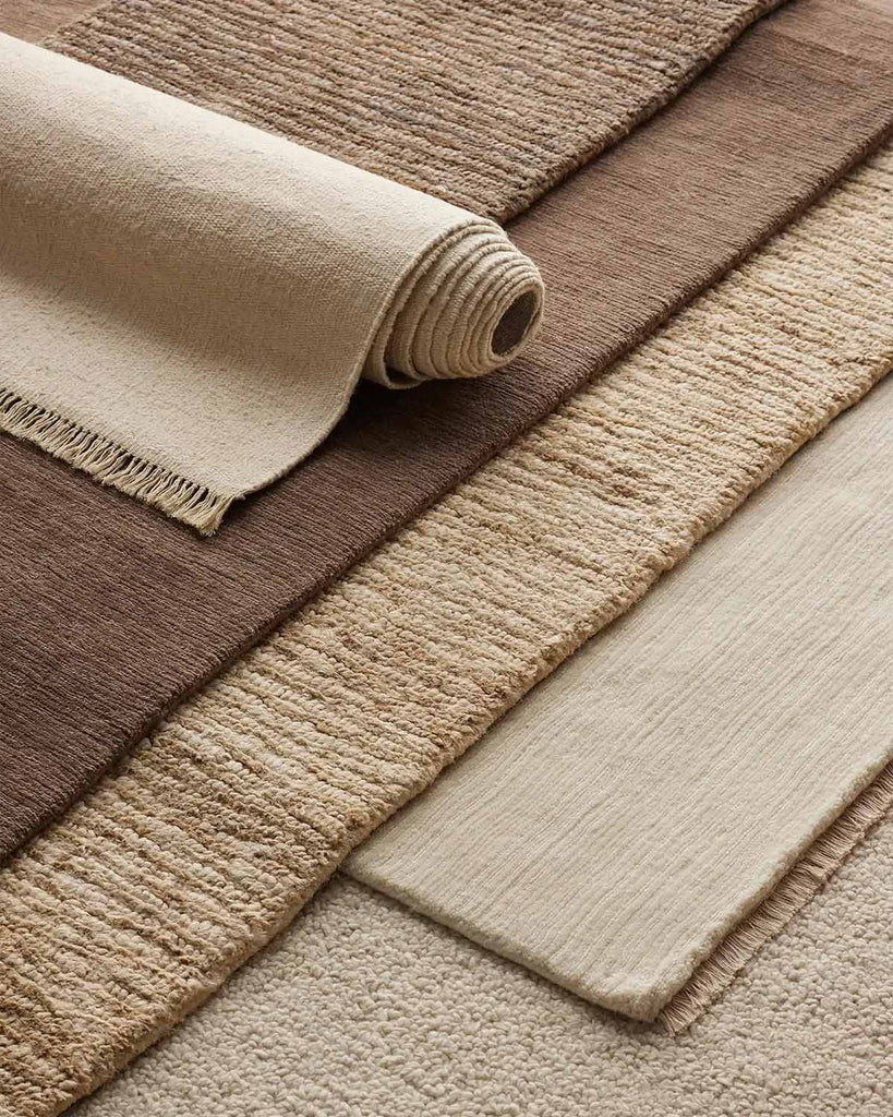 A number of floor rugs from Weave Home's new season, all in cream and neutral tones and with stunning contrasting textures. 