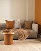 Modern living room setting featuring warm toned home decor including linen cushions by Baya