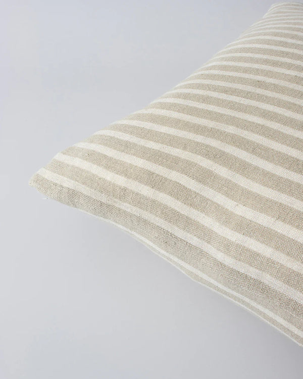 Close up of the Baya Spencer cushion in a classic cream and beige stripe