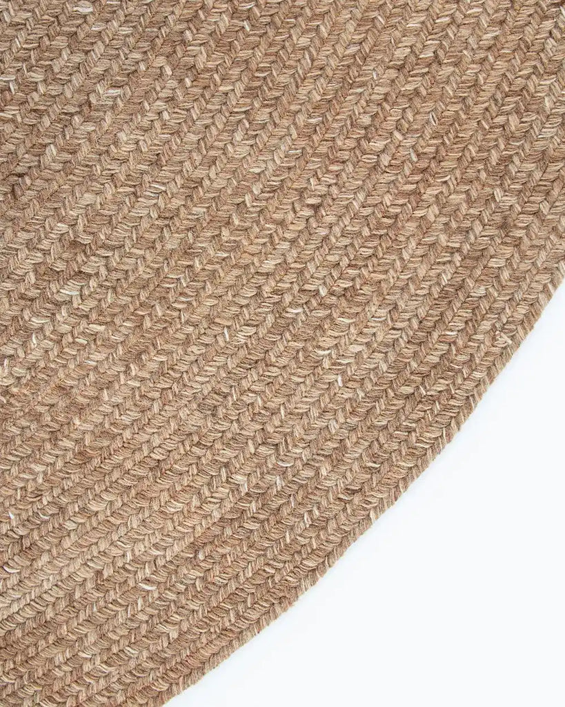 Close-up, corner view of the herringbone weave of Baya NZ's Mornington rug in Teak. 