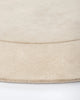 Edge detail of the Baya cream 'Form' curved floor rug