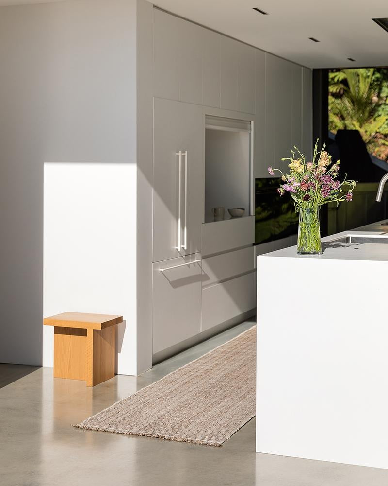 The Rhodes Teak runner rug seen in the kitchen of a stylish, modern home