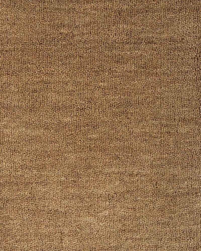 Extreme close up of the Baya Sandringham light-mid brown 'Fenugreek' wool rug, showing the sophisticated pile