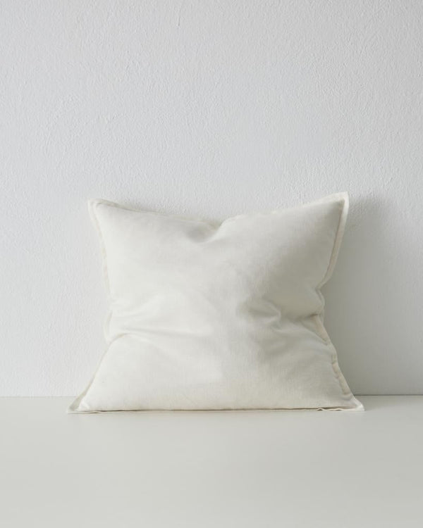 The Fiore cushion with flange edge, by Weave Home nz, in colour 'Salt' - a clean white.